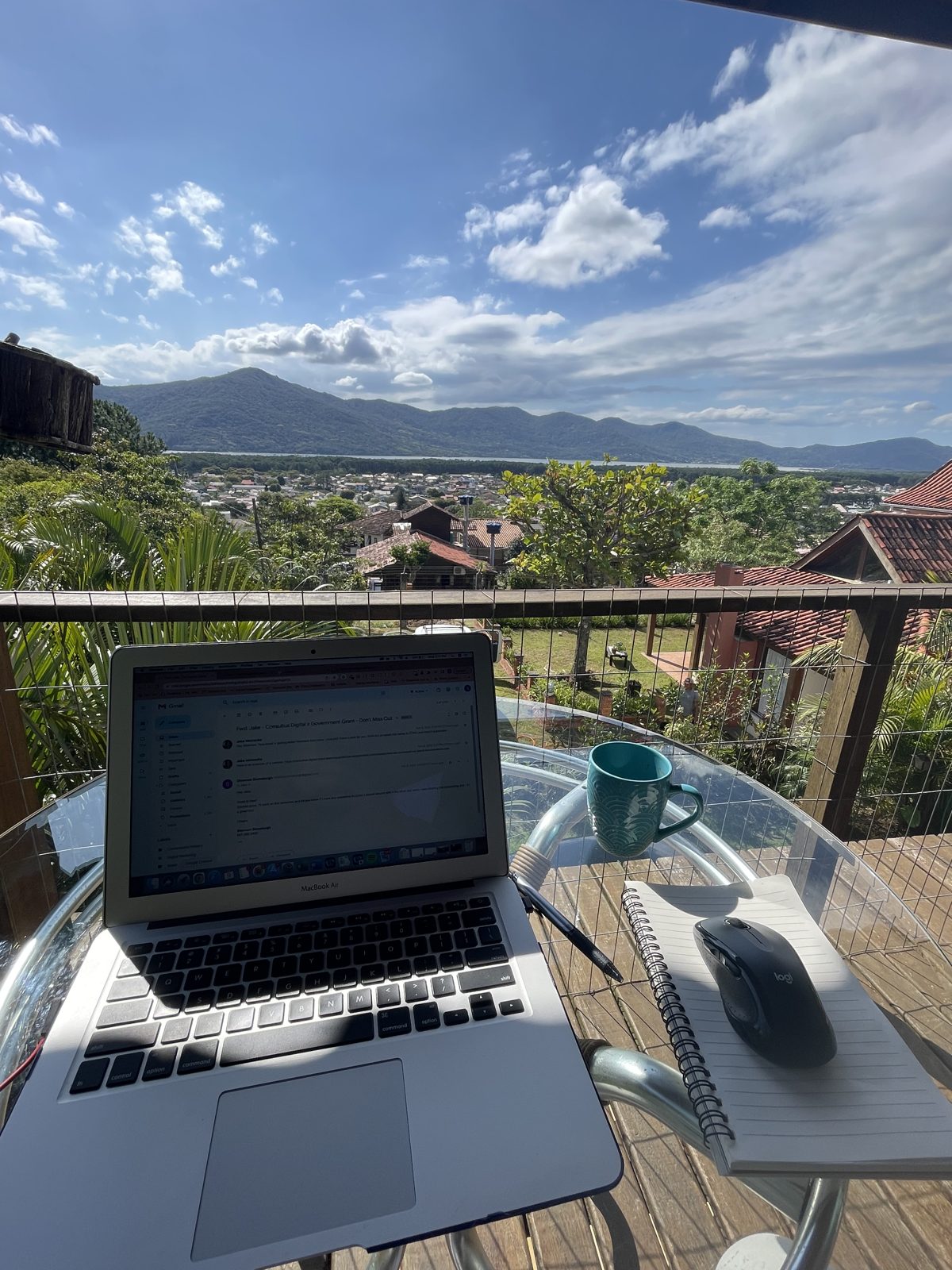 Working remotely with a laptop and a mountain view
