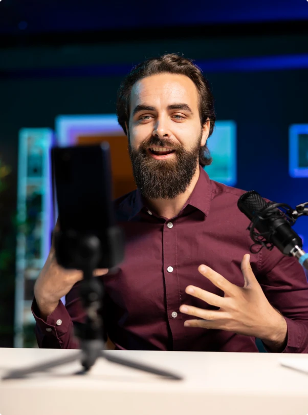 Creator talking to a phone camera on a tripod