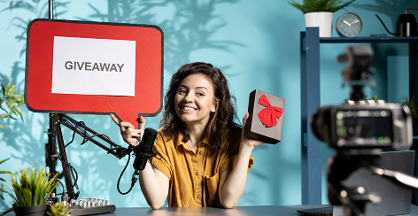 Presenter announcing a giveaway on a promotional video set
