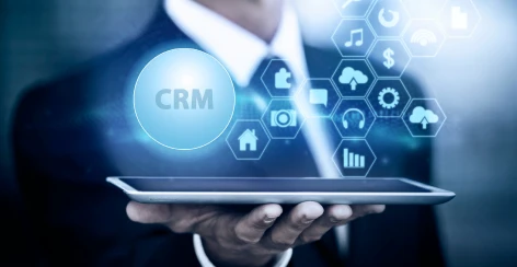 CRM icon network projected above a tablet