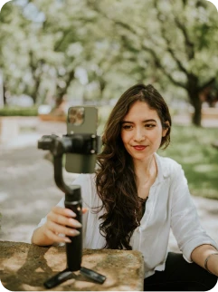 Creator filming UGC outdoors on a phone gimbal