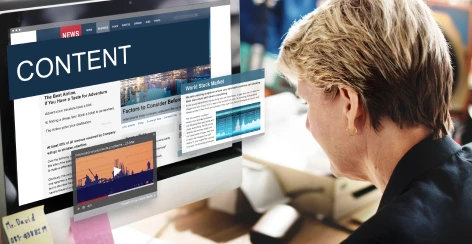 Woman reading content pages on a large screen
