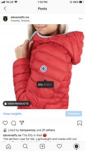 Screenshot of Instagram Shopping image of girl wearing ElevenElfs - Elfy vegan down jacket in Red.
