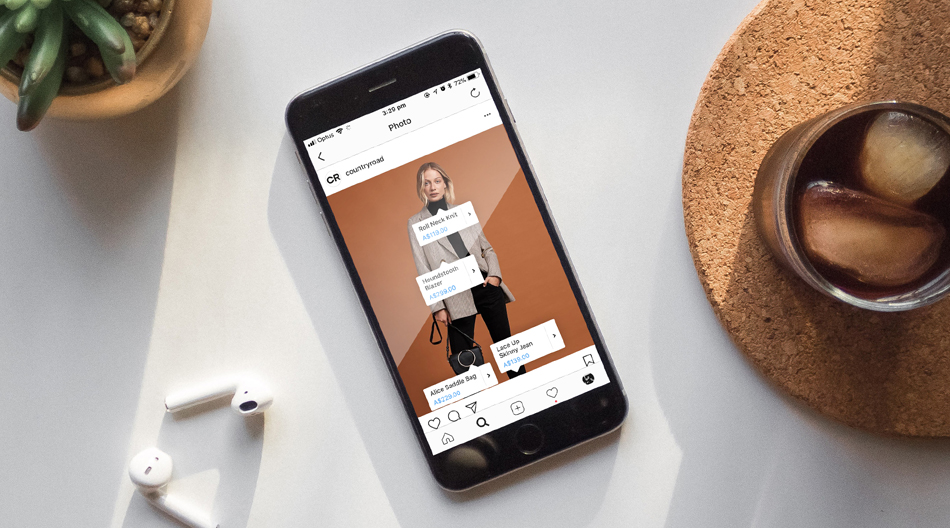 Image of phone with AirPods and iced coffee.