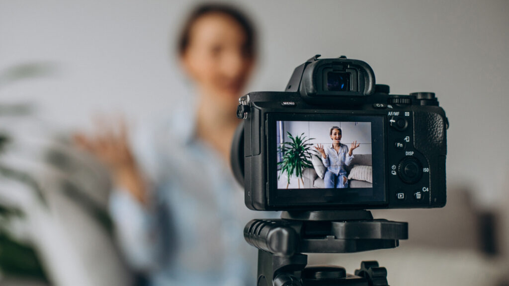 woman talking to camera- video testimonials blog