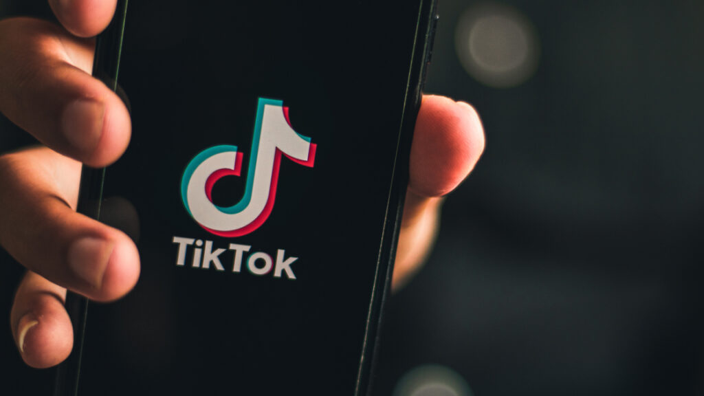 Three silhouettes of people converting into sales while they use Tiktok