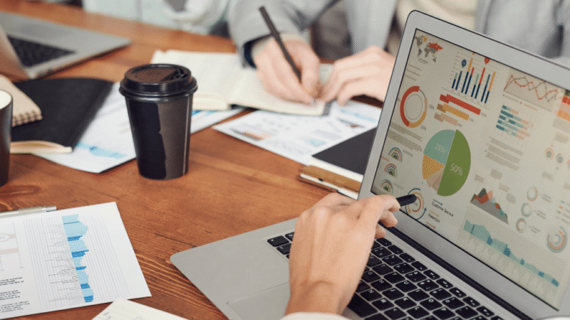 Digital marketer reviewing positive conversion rate optimization results on analytics tool