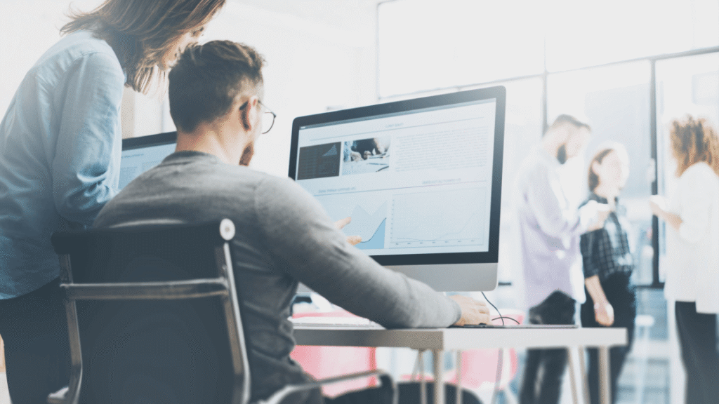 Two digital marketing and performance marketing professionals reviewing strategy for a Toronto client