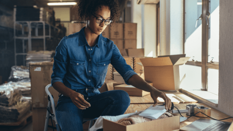 A female eCommerce store owner reviewing higher order numbers as a result of implementing CRO tips from Consultus Digital