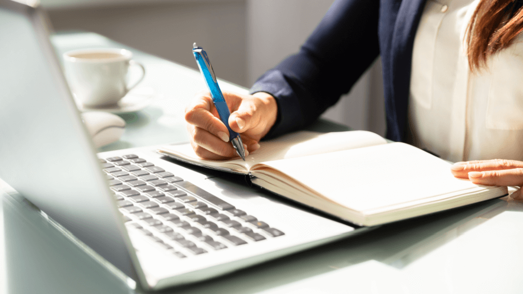 An insurance professional taking notes of the best practices of marketing automations