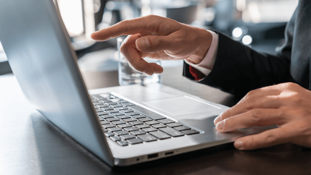 A digital marketers hand pointing to the screen at tips for maintaining a businesses online reputation