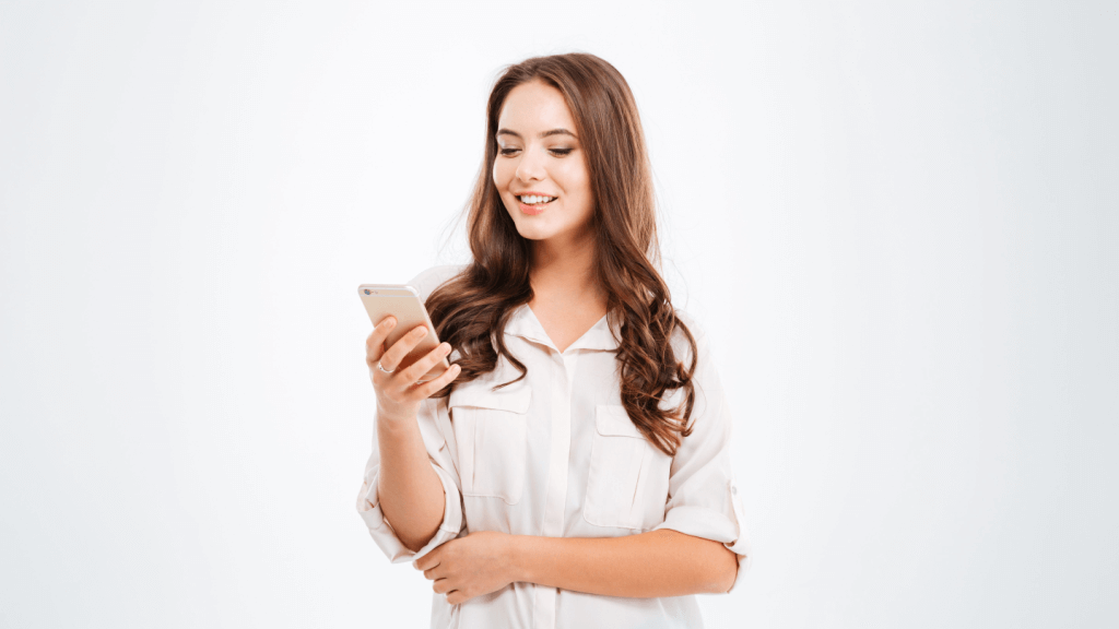 An influencer looking at her smart phone