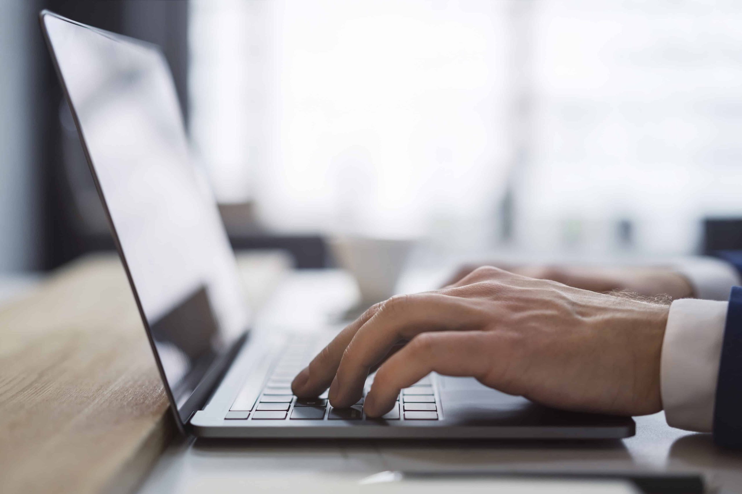 person writing a blog to help grow their business