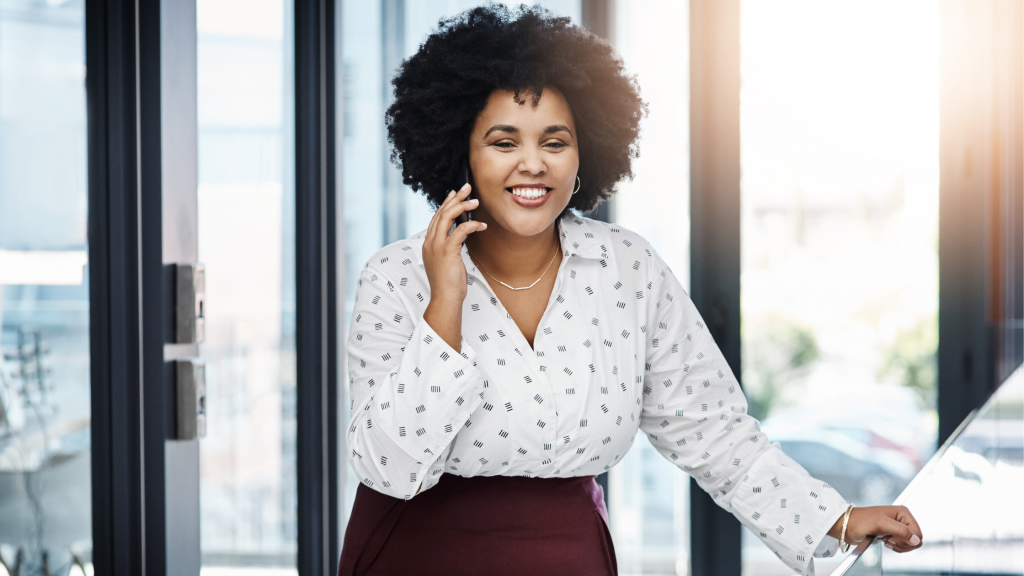 Social proof - woman smiling while on a phone call