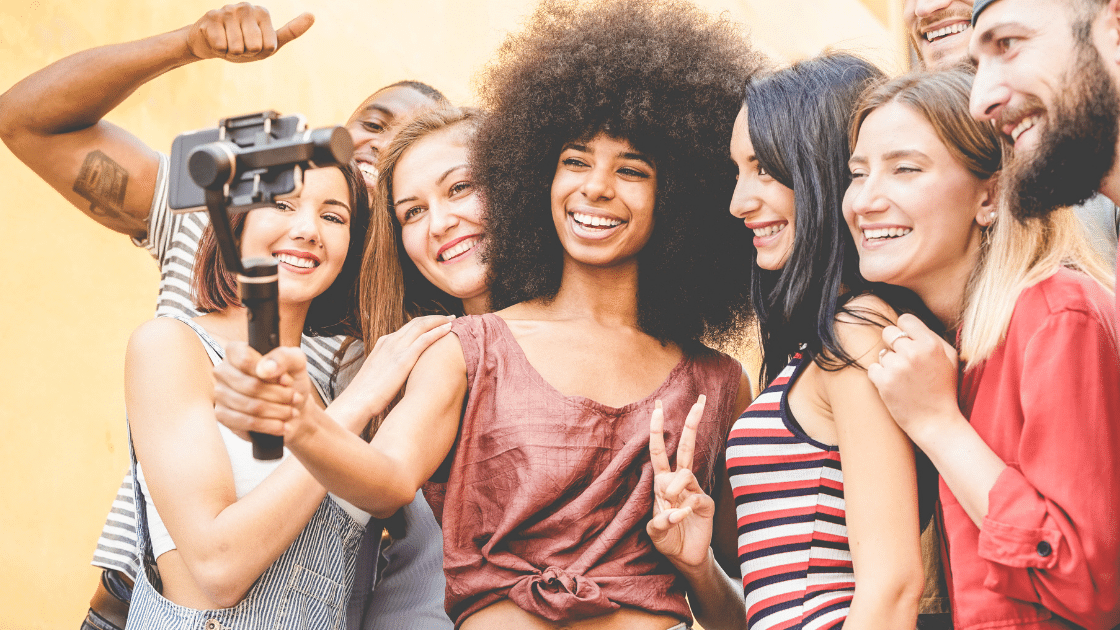B2C Influencer Marketing - woman taking a selfie with a group of people