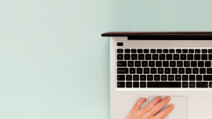 Content Marketing vs Copywriting - person using the trackpad on a laptop
