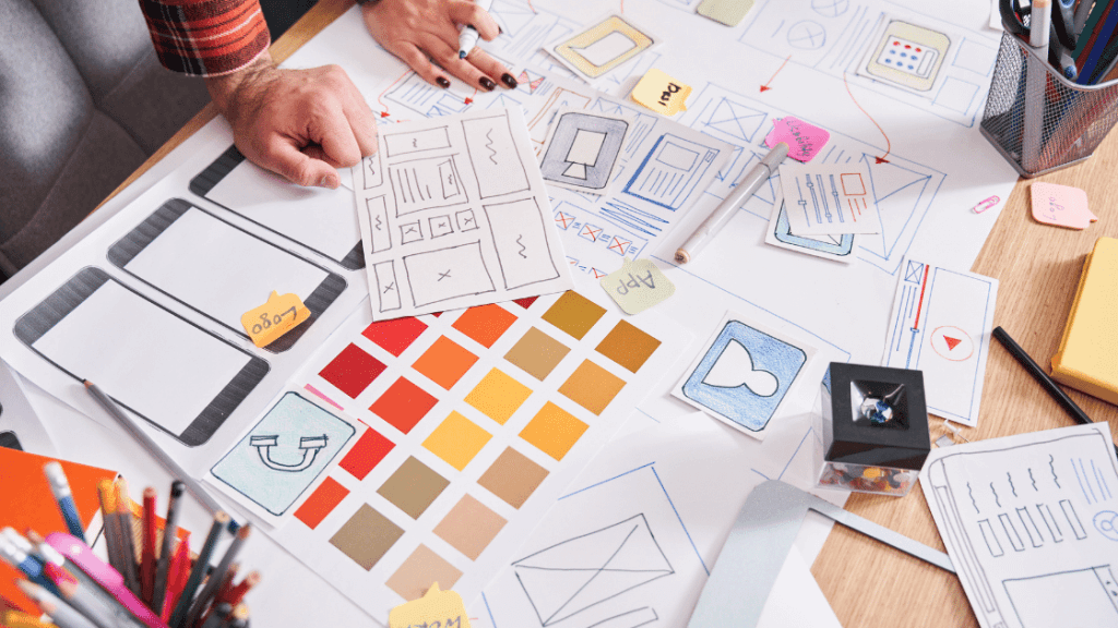 web design sketches laid out on table | High Converting Landing Page
