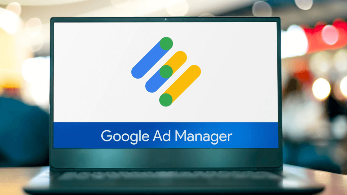 Google Ads management logo loading screen on a laptop